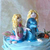 Mermaids with dolphin