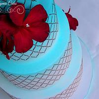 Djerba inspired wedding cake with red hibiscus