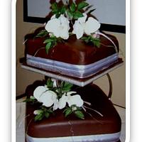 White Cymbidium Orchids on Belgium Chocolate wedding cakes