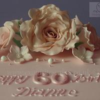 Pink rose and lace cake for a 60th birthday.