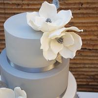 Wedding cake with marble fondant and magnolias