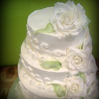 Classic wedding cake with sugar roses and bows