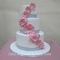 White, silver and pink wedding cake