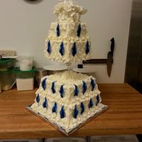 White & Royal blue feathers wedding cake