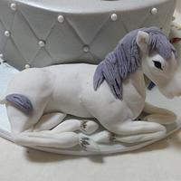 Silver and white ballet slippers and horse.