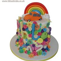 Flower Power Birthday Cake - with hancrafted edible beetle car and rainbow topper