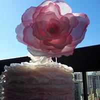 Ruffle pink cake with rice paper flowers