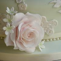 Embossed lace and sugar rose wedding cake