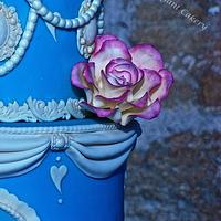 Blue vintage wedding cake with pink edged sugar roses