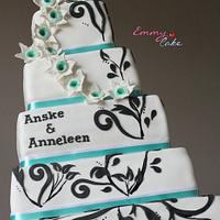 White wedding cake with turqouise and black details