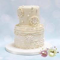 Two tier ruffles, pearls and 'bling' wedding cake