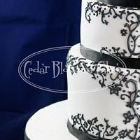 Black and white pressure piped wedding cake