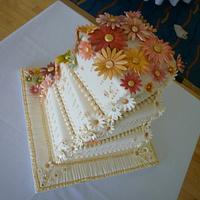 Autumnal Cascading Daisies Wedding Cake