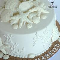 All white beach wedding cake