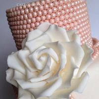 Twenties inspired blush pearl wedding cake