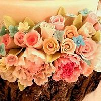 Lace and flowers wedding cake