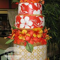Hawaiian wedding cake featuring hibiscus flowers & bamboo