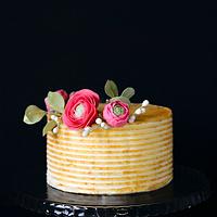 gold cake with sugar flowers