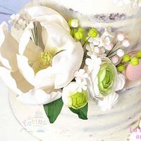 Naked cake with large magnolia gumpaste flower