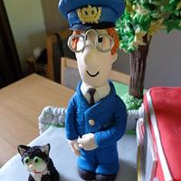 Postman Pat and his black and white cat.