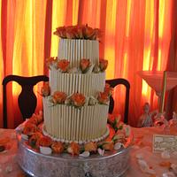 white chocolate wedding cake with fresh roses