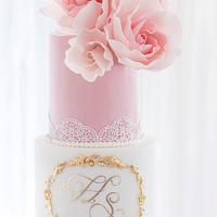 Pink white wedding cake with gold sequins