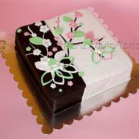 White/brown cake with flowers