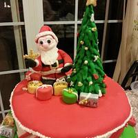 Gift box Christmas Cake - Santa with lots of gifts.