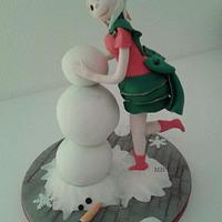 Christmas elf playing in the snow