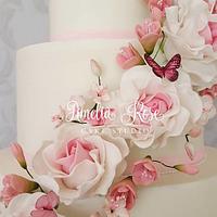 Pink rose and butterfly cascade wedding cake