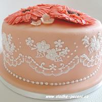 Birthday cake with lace and gerbera flowers