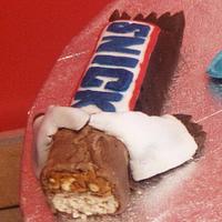 snickers bar and packet of crisps made out of fondant