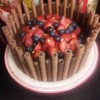 chocolate cake with cigarellos and fresh berries