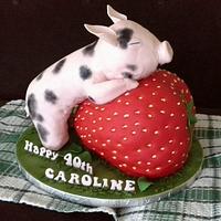 Birthday pig on a strawberry