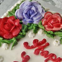 Red & Purple buttercream roses on sheet cake
