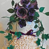 Purple roses theme wedding cake 