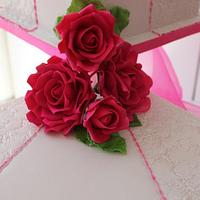 3 Tier square embossed wedding cake with Hot pink handmade roses