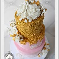 Pink cake with golden sequences. 