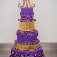 Violet and gold wedding cake.