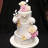 Wedding cake with flowers of edible paper
