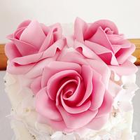 Ivory lace and roses wedding cake