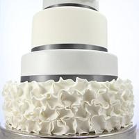 Silver and white ruffle wedding cake