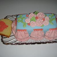 white cake with pink heart inside.