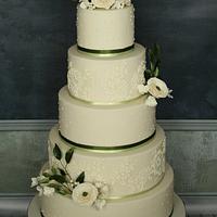 Cream and olive ranunculus wedding cake