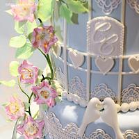 Birdcage, lace and briar rose wedding cake