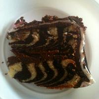 Zebra print cake with a loopy bow.