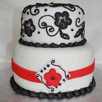 black embossed flowers with red ribbon