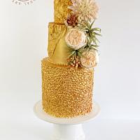 Golden Wedding Cake with roses, dahlia and succulents.