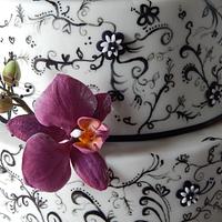 Hand painted magenta orchid and butterfly cake.