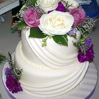 Swag Wedding cake with fresh flowers